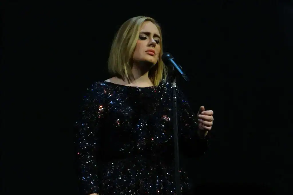 Adele singing onstage during her Adele Live 2016 concert in Nashville.